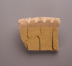 Staffordshire slipware trailed and combed dish with pie crust rim.