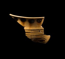 Staffordshire slipware trailed and dotted drinking pot.