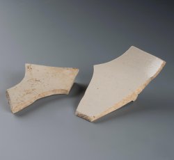 White salt glaze stoneware hollow vessel with footring.