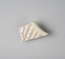 White salt glaze stoneware dot, diaper, and basket molded plate or dish.