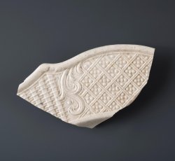White salt glaze stoneware dot, diaper, and basket molded dish.