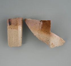 English Brown stoneware hollow vessel with handle.