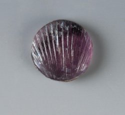 Amethyst glass sleeve button inlay with molded scalloped clam shell shape.