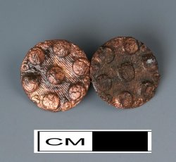 Pair of cast copper alloy sleeve buttons with link.