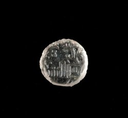 Colorless glass sleeve button inlay with molded house, 2 trees, fence, and path.