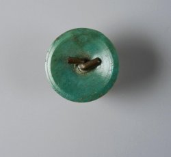 Bone back to coat button with wire eye.