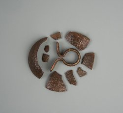 Copper alloy two-piece domed waist coat button face and shank.
