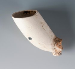 Tobacco pipe with molded &quot;W&quot; and &quot;M&quot; with crown either side of heel and stamped &quot;WM&quot; with botanical inside half-circle on bowl. 