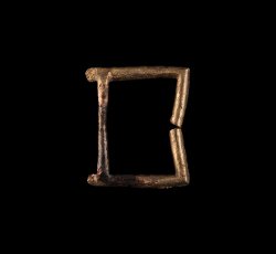 Coppery alloy single frame strap buckle.