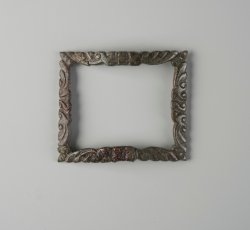 Copper alloy shoe buckle frame with gilt rococo scrollwork decoration.