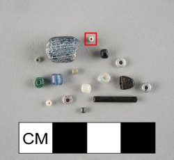 Drawn, simple, barrel-shaped white seed bead with clear casing