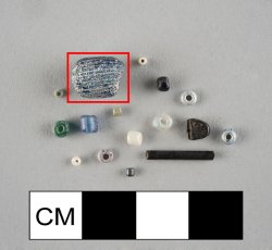 Drawn, large, simple, blue barrel-shaped bead with white stripes parallel to perforation