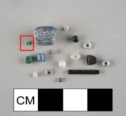 Drawn, simple, sub-spherical, blue-green seed bead