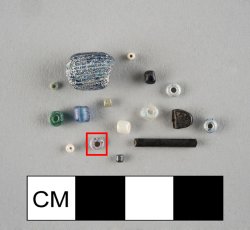 Drawn, simple, sub-spherical, red seed bead