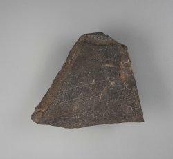 Cut slate with marks.