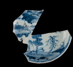Painted underglaze porcelain saucer with landscape motif.