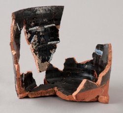 Red-bodied, black lead glazed mug.