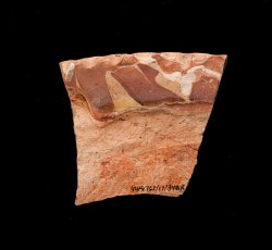 Unidentified slipware plate with pie crust molded rim.