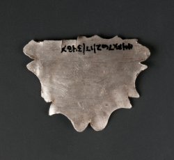 Silver scabbard collar fragment engraved with the bottom of George Washington's monogram, "GW".