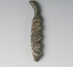 Unidentified clothing buckle frame with scrollwork.