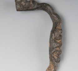 Unidentified clothing buckle frame with scrollwork.