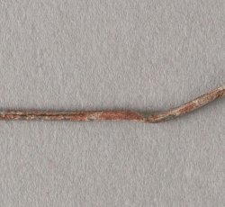 Straight pin with handmade head and some tinning visible.