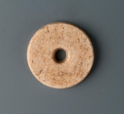 Single-holed bone button mold or blank.