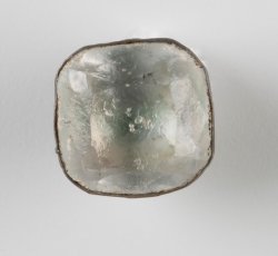 Faceted colorless glass inset sleeve button.