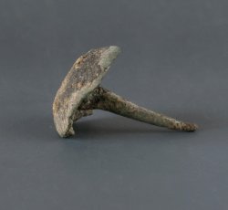 Small copper alloy tack.