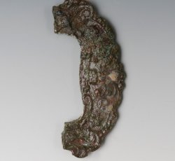 Shoe buckle frame with scrollwork decoration and scalloped edge.