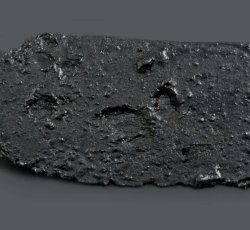 Curved iron knife blade.