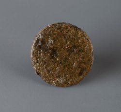 Copper alloy button.