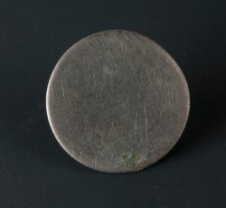 Flat disc button.