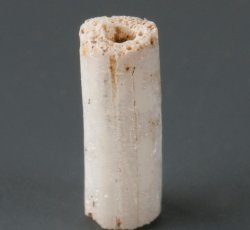 Drawn, compound, tubular white bead, small.