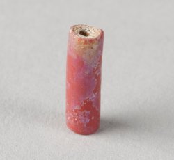 Drawn, compound tubular red bead, long.