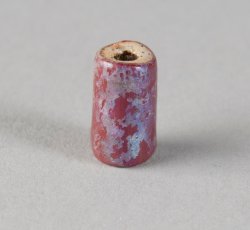 Drawn, compound tubular red bead, wide.