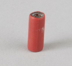 Drawn, compound tubular red bead, average length.