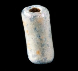 Drawn, simple, tubular blue bead.