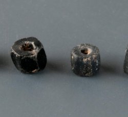 Drawn, simple, faceted black bead.