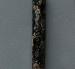 Thin, black, drawn, simple tubular bead.