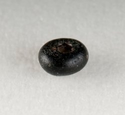 Drawn, simple, sub-spherical, black bead.