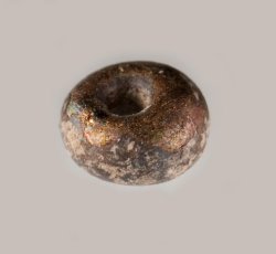 Drawn, simple, sub-spherical, black bead.