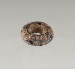 Drawn, simple, sub-spherical, black bead.