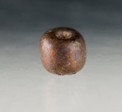 Drawn, simple, sub-spherical, black bead.