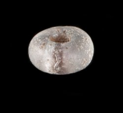 Drawn, simple, sub-spherical, clear bead.