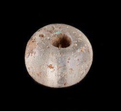 Drawn, simple, sub-spherical, clear bead.