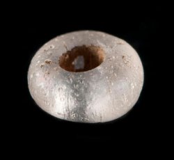 Drawn, simple, sub-spherical, clear bead.