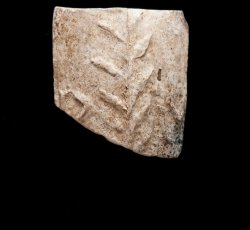 Tobacco pipe bowl fragment with armorial decoration and an ÒRMÓ mark.
