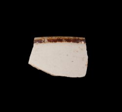 White slip-dipped stoneware mug rim.