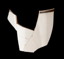 White slip-dipped stoneware mug rim and body.
